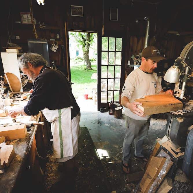 father and son working in shared duck decoy carving workshop